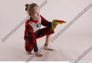 DENISA SITTING POSE WITH GUN